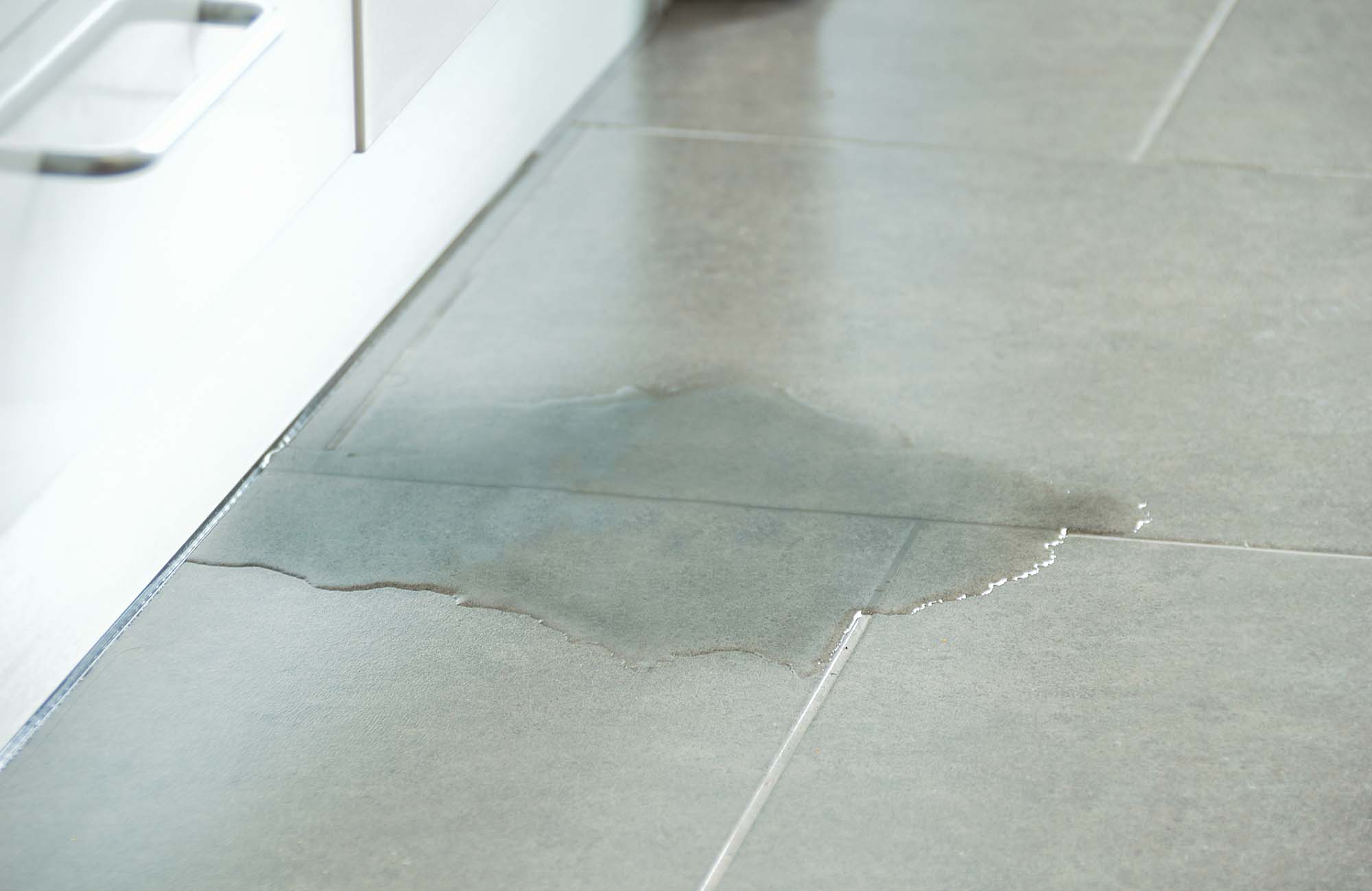 Water leak on tile floor